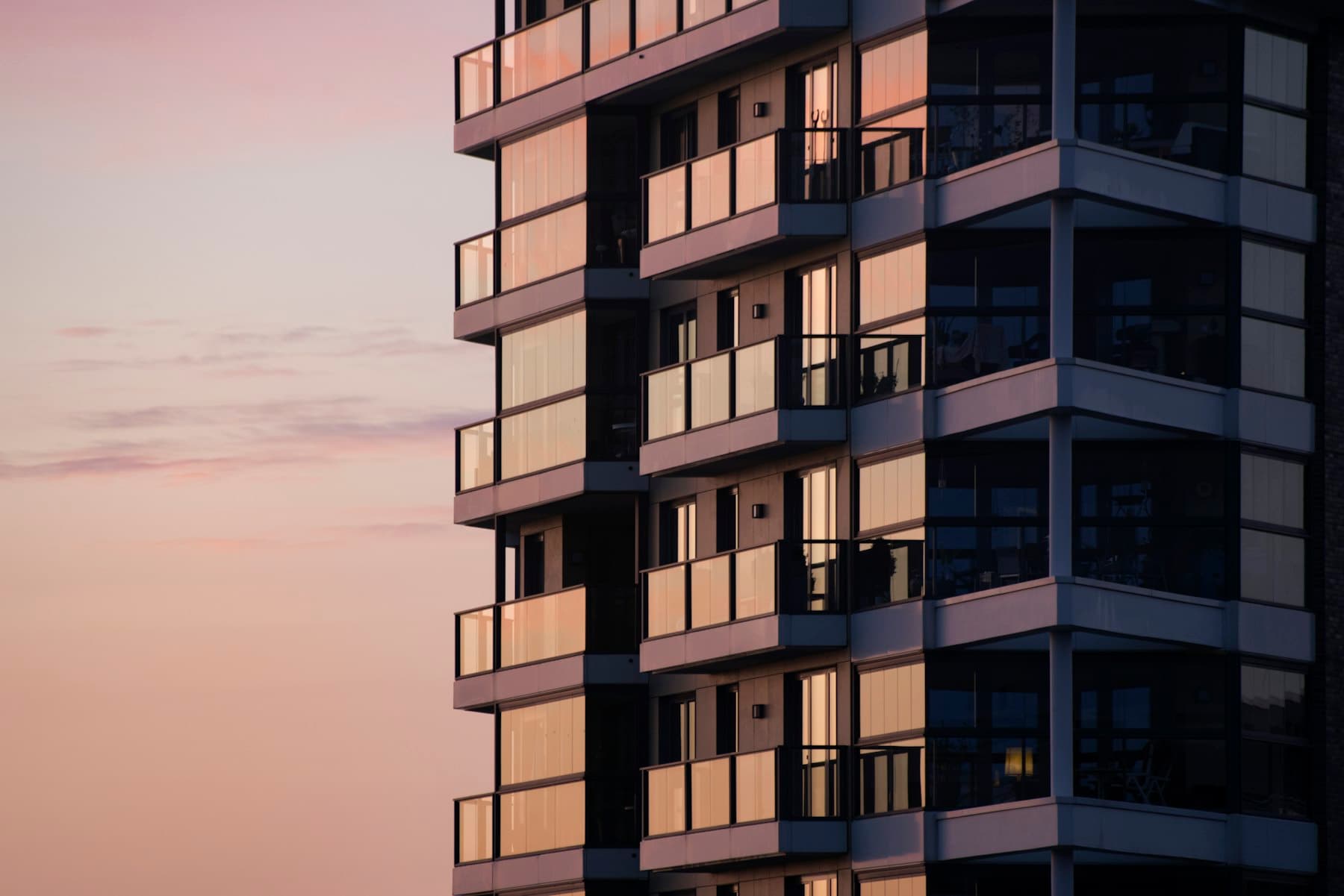 Modern residential tower at dusk