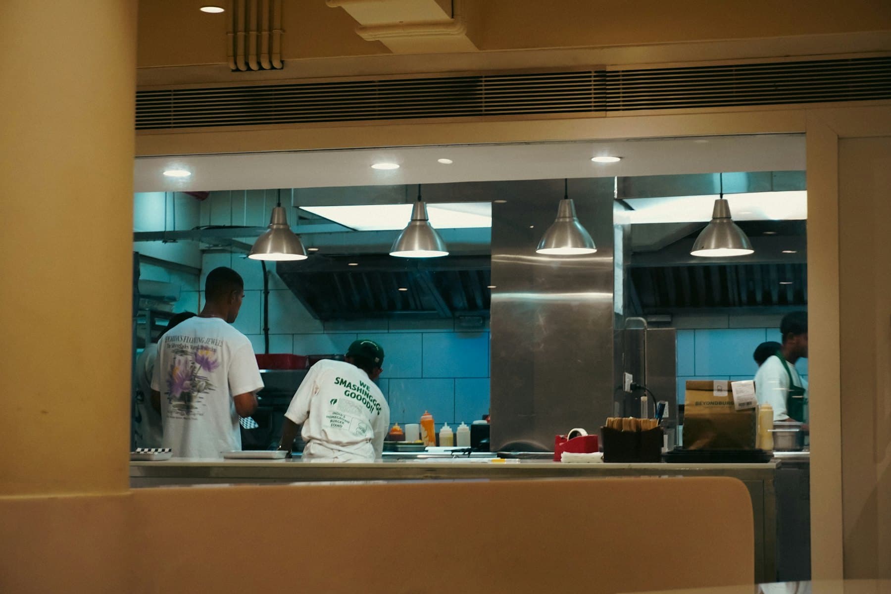 Kitchen staff preparing food in a commercial kitchen